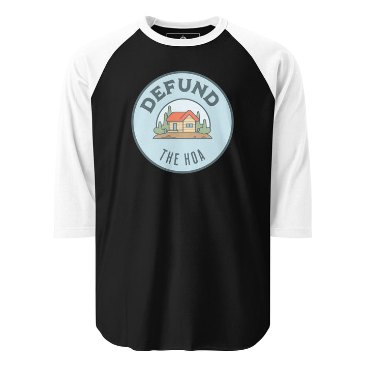 Defund The HOA funny suburban graphic tee — circular badge with cartoon house and trees and DEFUND THE HOA text