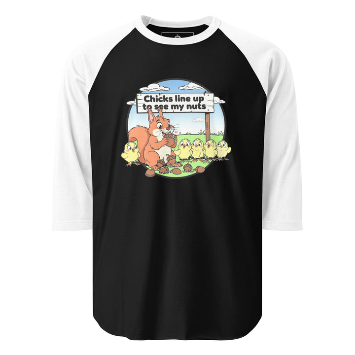 Chicks Line Up To See My Nuts — a cartoon squirrel holding acorns while baby chicks line up behind a sign reading Chicks Line Up To See My Nuts, printed on a 3/4 sleeve raglan shirt.