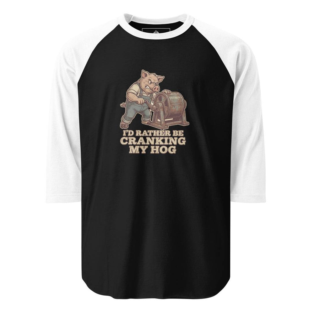I'd Rather Be Cranking My Hog — an overalls-wearing pig cranking an old hand-crank machine, captioned I'd Rather Be Cranking My Hog, printed on a 3/4 sleeve raglan shirt.