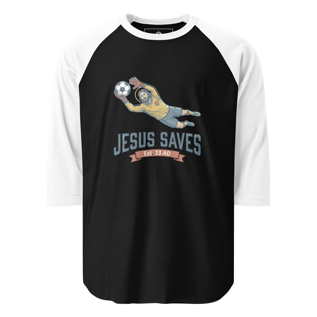 Jesus Saves — Jesus as a soccer goalkeeper diving to catch the ball with a halo, captioned Jesus Saves Est 33 AD, printed on a 3/4 sleeve raglan shirt.
