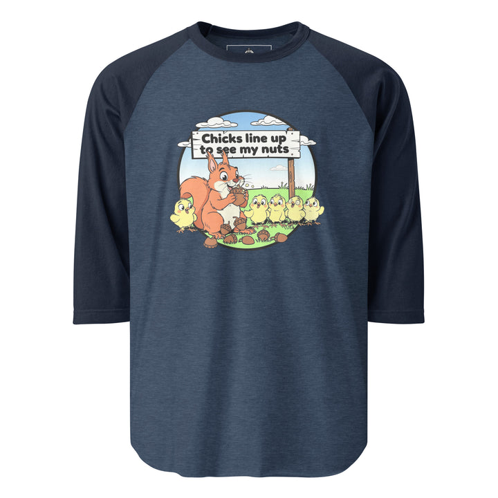 Chicks Line Up To See My Nuts — a cartoon squirrel holding acorns while baby chicks line up behind a sign reading Chicks Line Up To See My Nuts, printed on a 3/4 sleeve raglan shirt.
