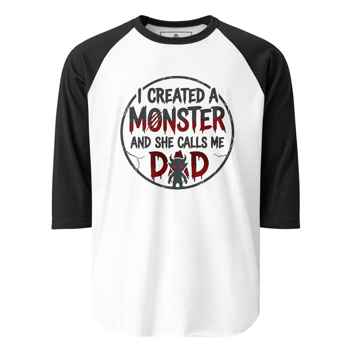 I Created A Monster And She Calls Me Dad funny graphic tee — horror style lettering with a small devil monster forming the A in DAD