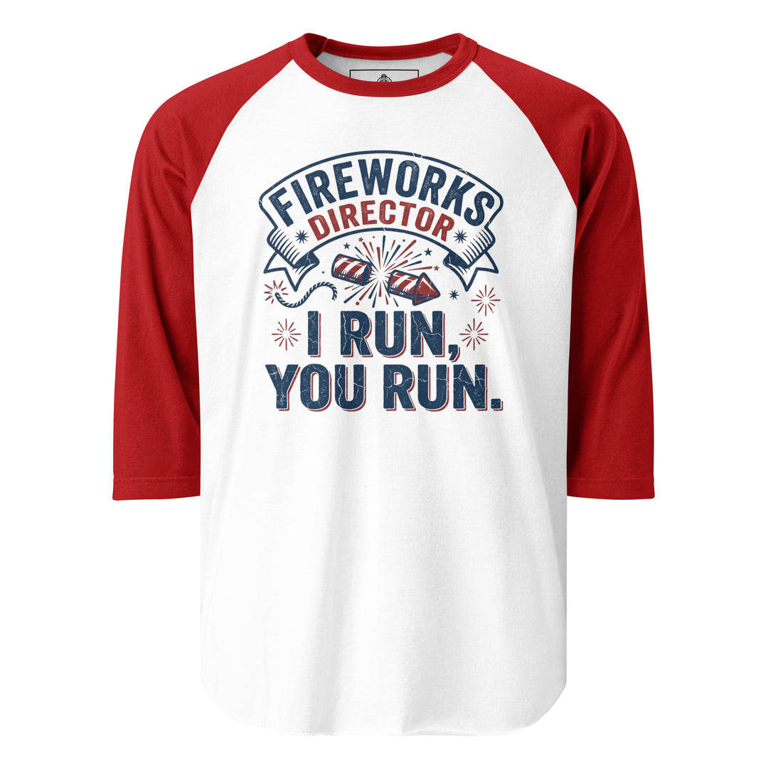 Fireworks Director funny 4th of July graphic tee — vintage banner with firework rockets and FIREWORKS DIRECTOR I RUN YOU RUN text in red white and blue on white tee