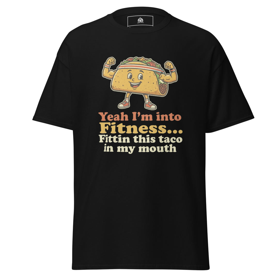 Yeah I'm Into Fitness Fittin This Taco In My Mouth funny graphic tee — flexing cartoon taco wearing a sweatband and sneakers