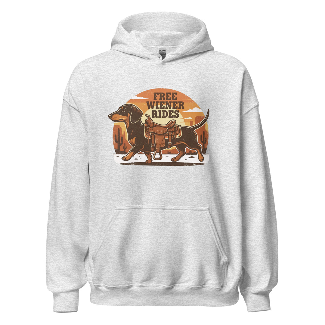 Free Wiener Rides — a dachshund wearing a western saddle in a desert sunset, captioned Free Wiener Rides, printed on a unisex hoodie.