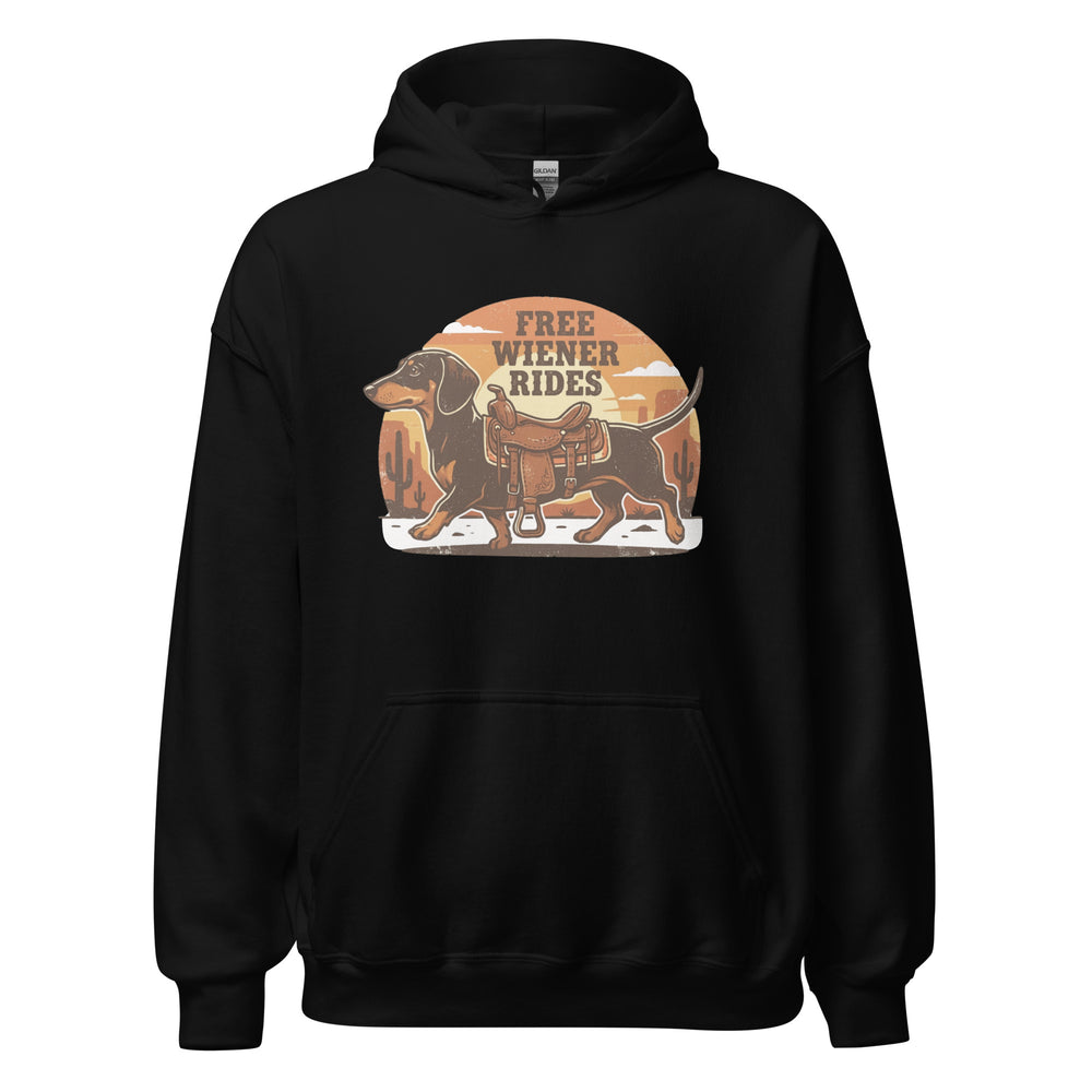 Free Wiener Rides — a dachshund wearing a western saddle in a desert sunset, captioned Free Wiener Rides, printed on a unisex hoodie.