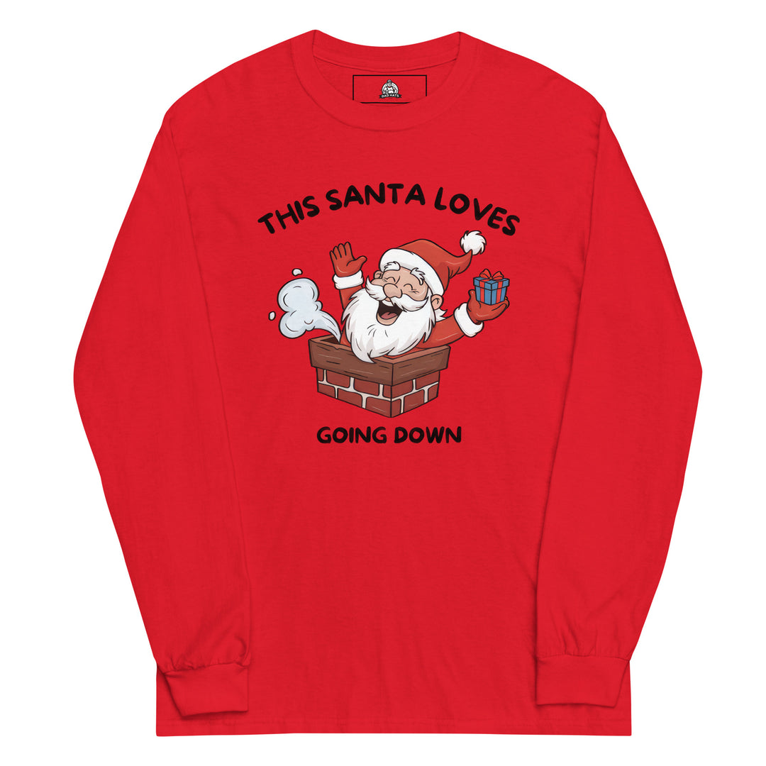 This Santa Loves Going Down — a cheerful Santa popping out of a chimney holding a gift, captioned This Santa Loves Going Down, printed on a long sleeve shirt.