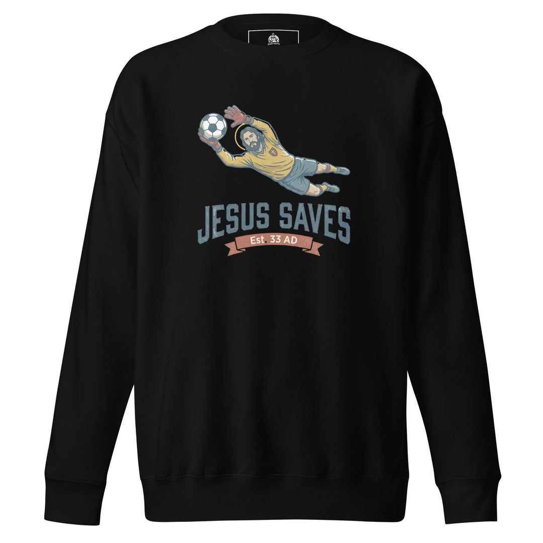 Jesus Saves — Jesus as a soccer goalkeeper diving to catch the ball with a halo, captioned Jesus Saves Est 33 AD, printed on a unisex sweatshirt.