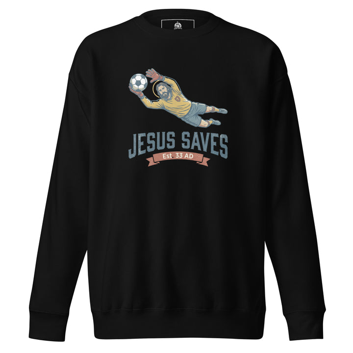 Jesus Saves — Jesus as a soccer goalkeeper diving to catch the ball with a halo, captioned Jesus Saves Est 33 AD, printed on a unisex sweatshirt.
