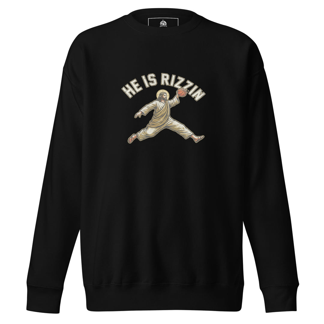 He Is Rizzin — Jesus doing a Jordan-style basketball dunk with a halo, captioned He Is Rizzin, printed on a unisex sweatshirt.
