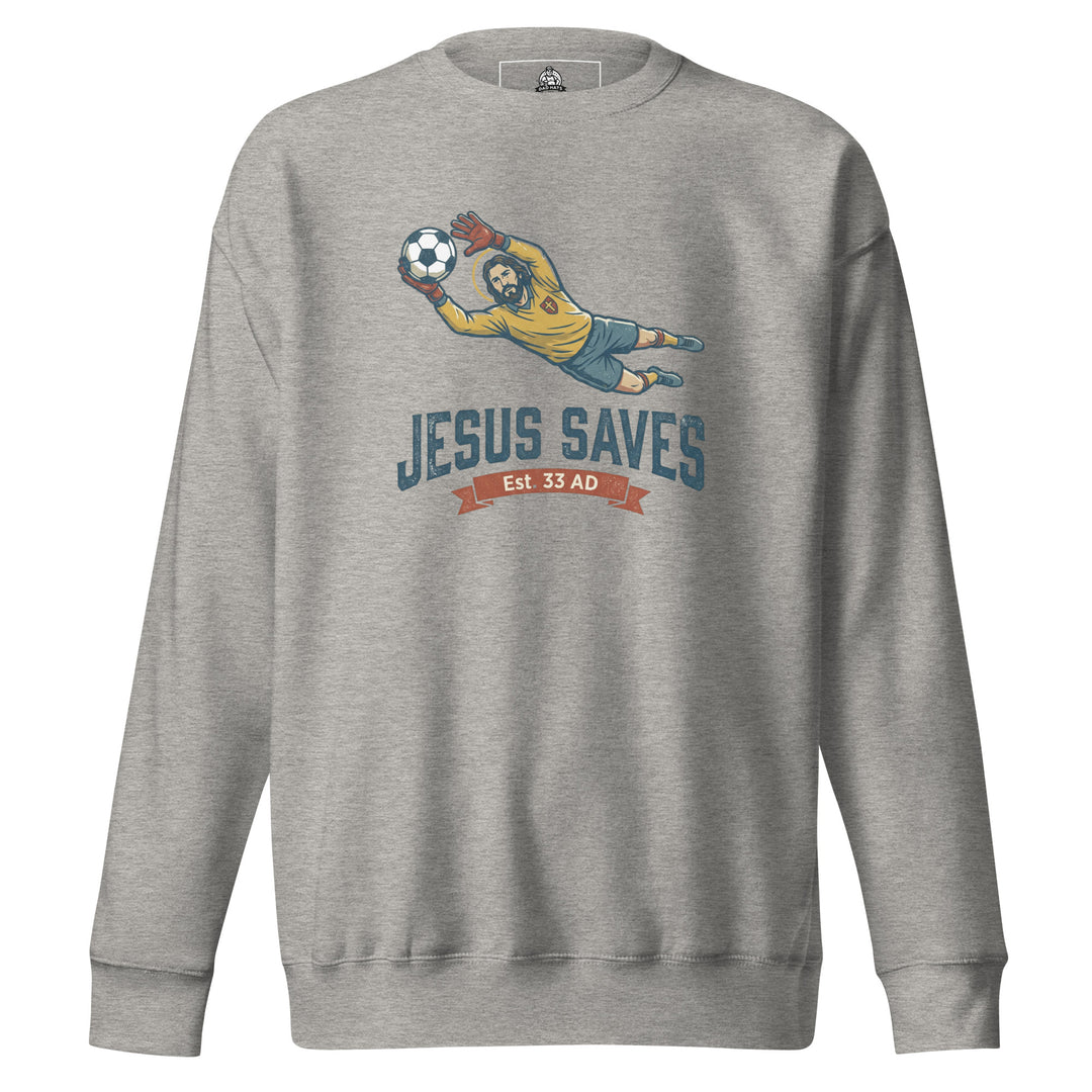 Jesus Saves — Jesus as a soccer goalkeeper diving to catch the ball with a halo, captioned Jesus Saves Est 33 AD, printed on a unisex sweatshirt.