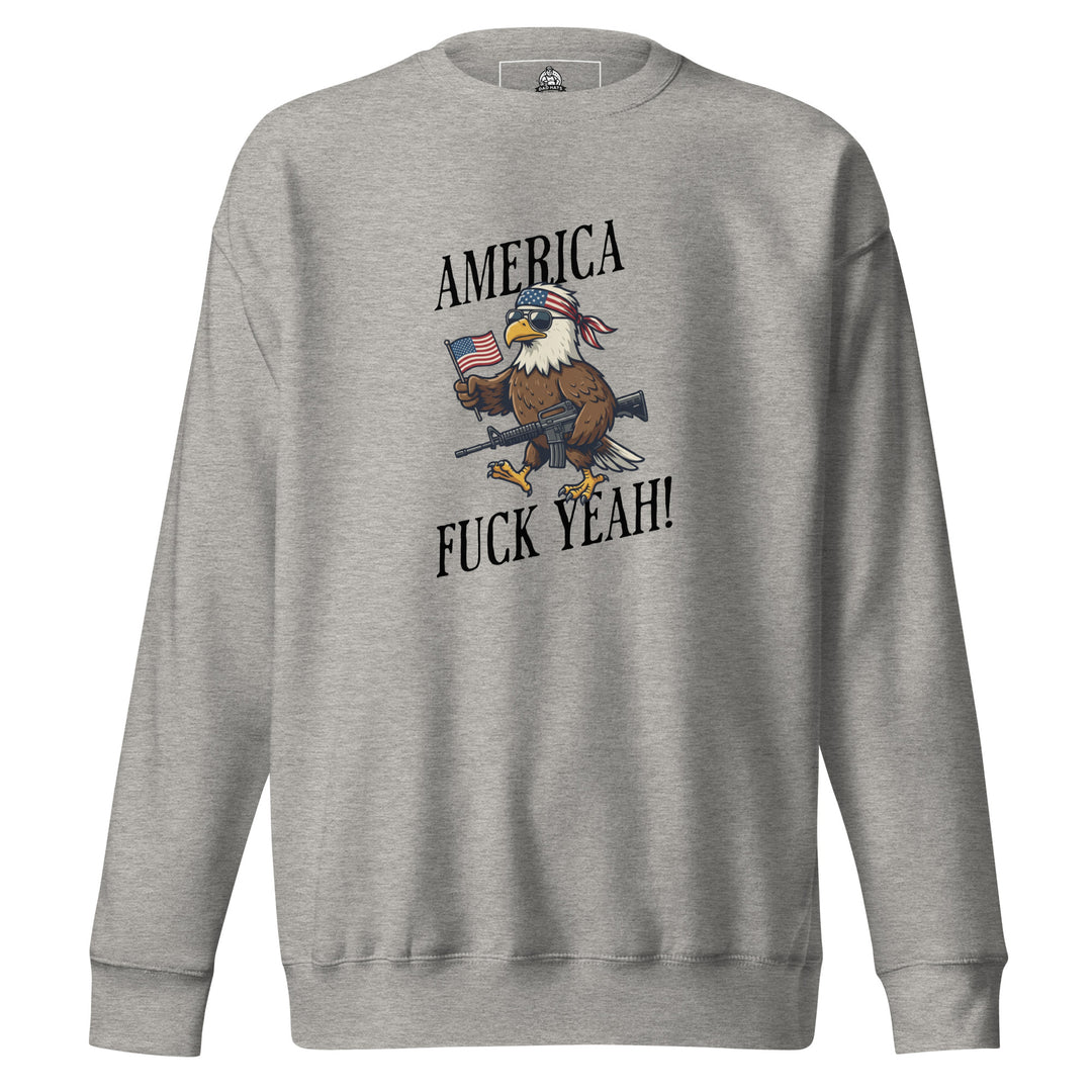 America Fuck Yeah — a bald eagle in a USA flag bandana and sunglasses holding an American flag and a rifle, with the words America Fuck Yeah, printed on a unisex sweatshirt.