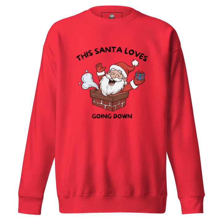 This Santa Loves Going Down — a cheerful Santa popping out of a chimney holding a gift, captioned This Santa Loves Going Down, printed on a unisex sweatshirt.
