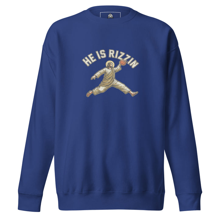 He Is Rizzin — Jesus doing a Jordan-style basketball dunk with a halo, captioned He Is Rizzin, printed on a unisex sweatshirt.